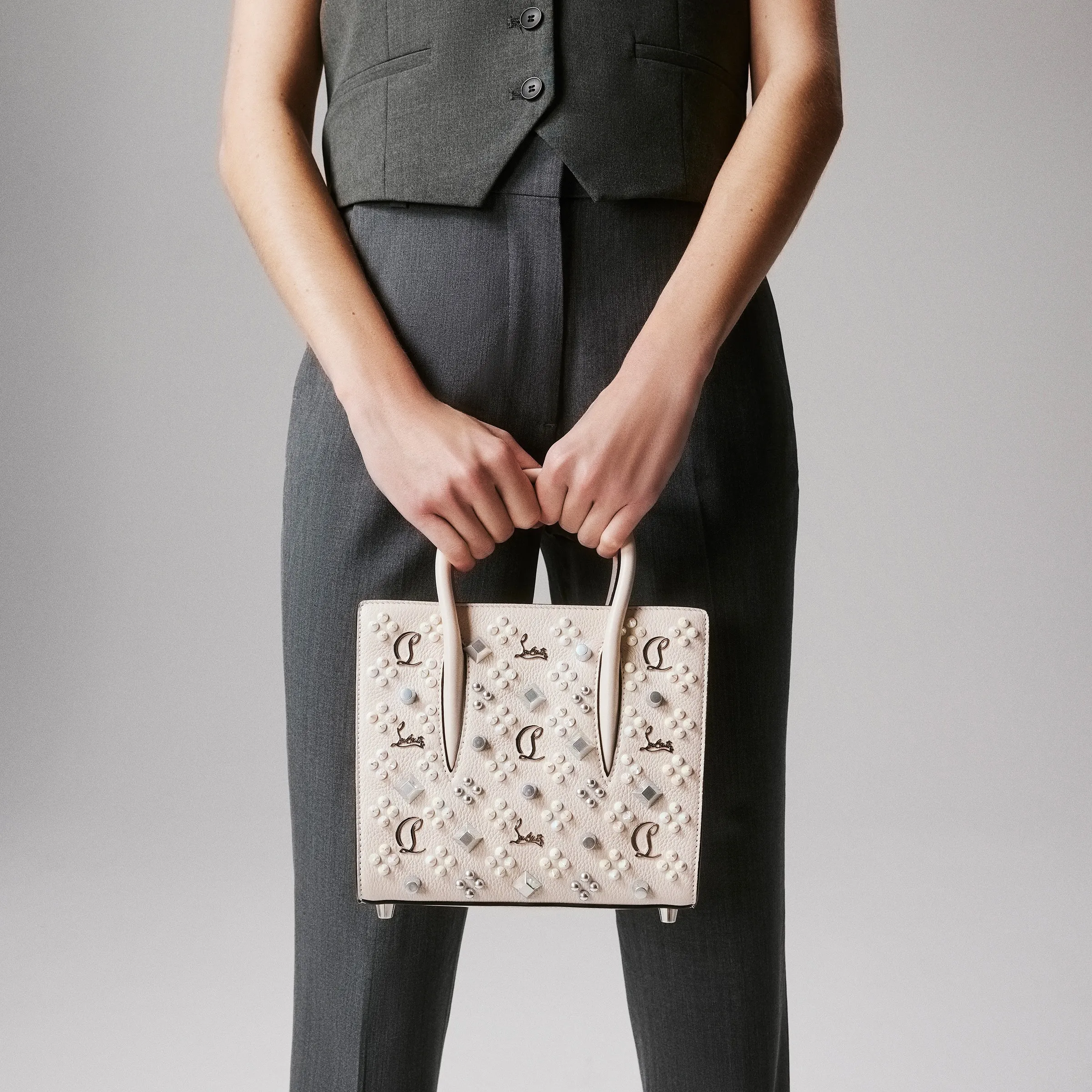 Christian Louboutin Paloma mini – Top handle bag – Grained calf leather and spikes Loubinthesky – Leche - Paloma mini - front view